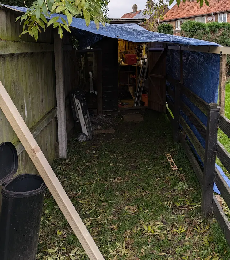DIY paint booth made from tarpaulin and wooden frame