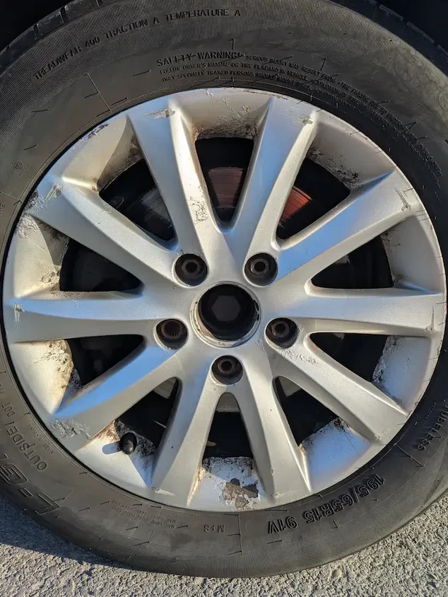 Wheel on a Mark 5 Volkswagen Golf - damaged and paint peeling