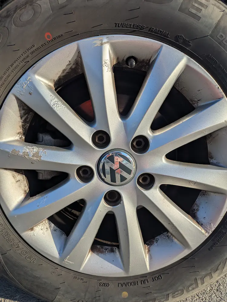 Wheel on a Mark 5 Volkswagen Golf - damaged and paint peeling