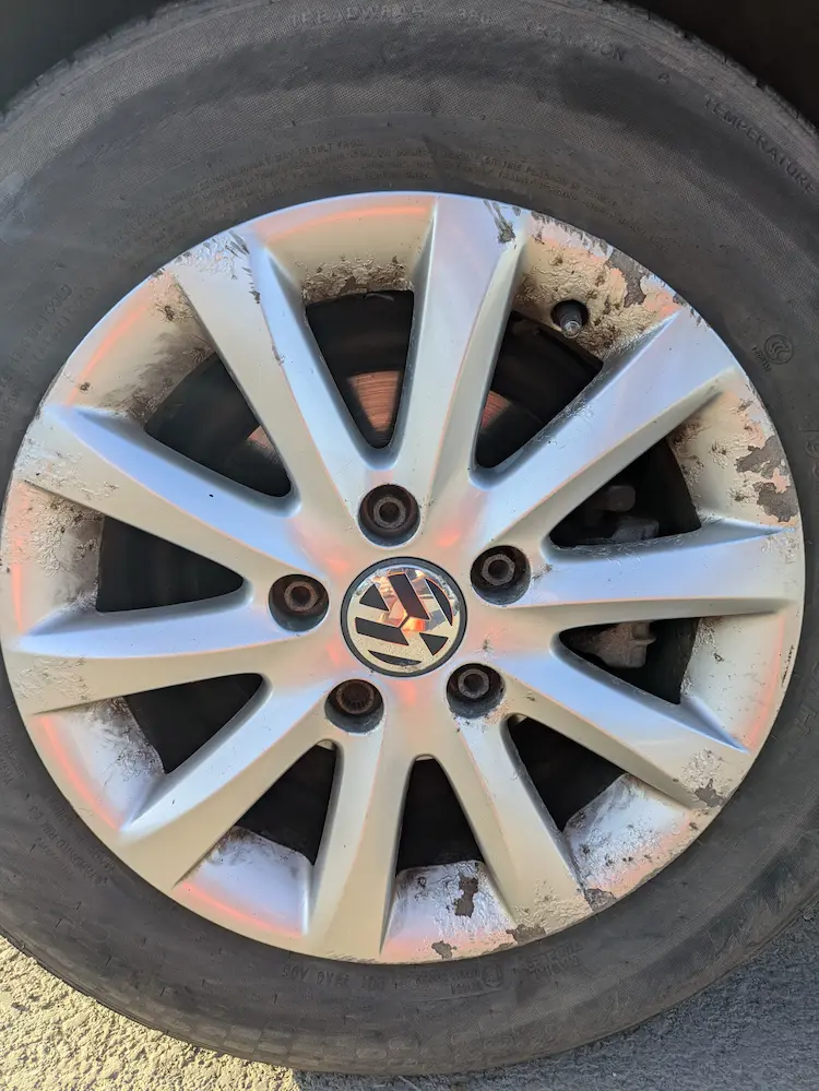 Wheel on a Mark 5 Volkswagen Golf - damaged and paint peeling