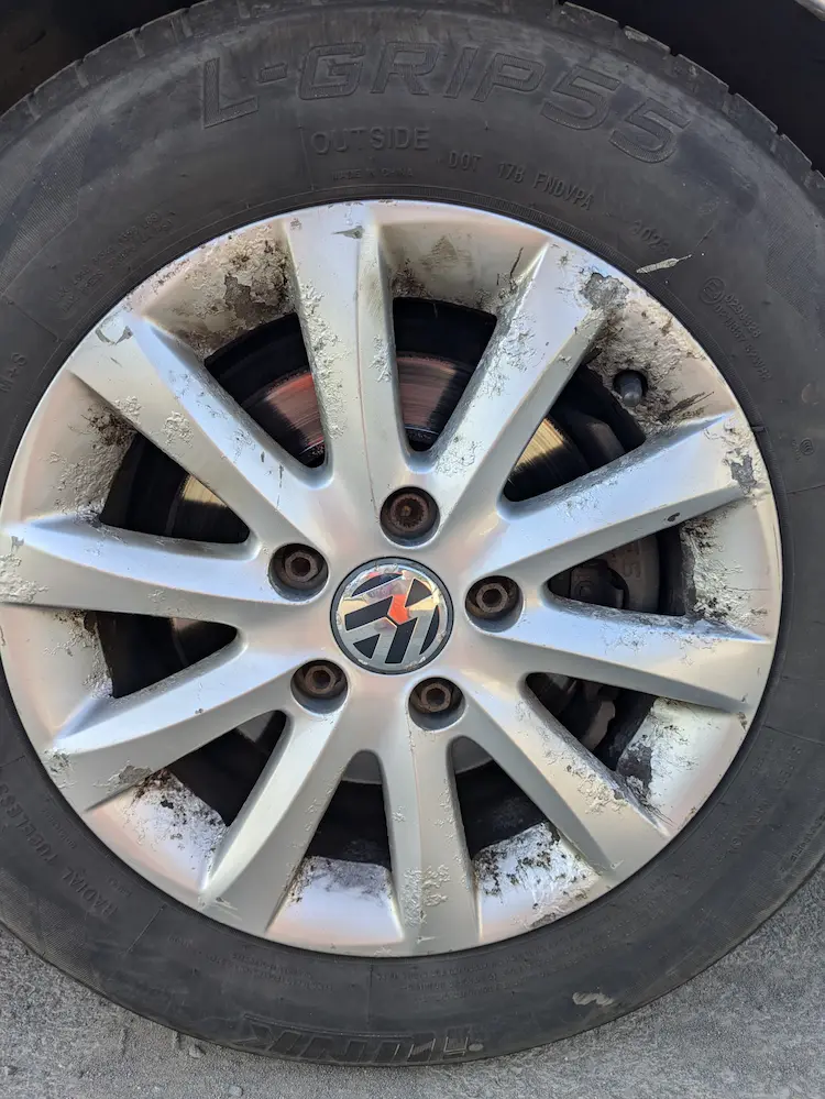 Wheel on a Mark 5 Volkswagen Golf - damaged and paint peeling